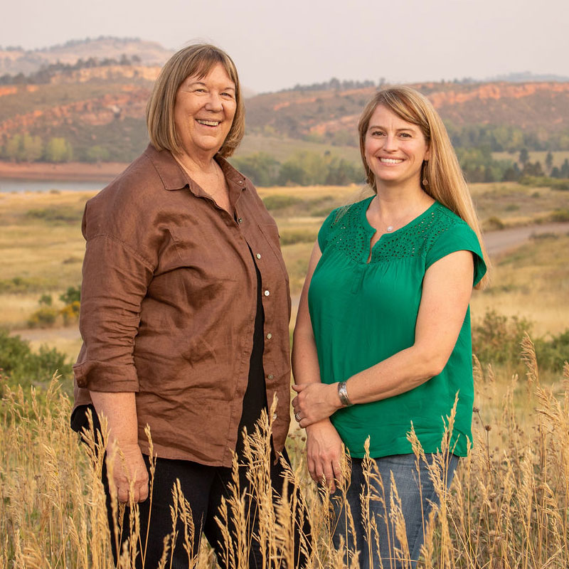 Company owners Carla Pollock and Sandy Hogan standing in a field